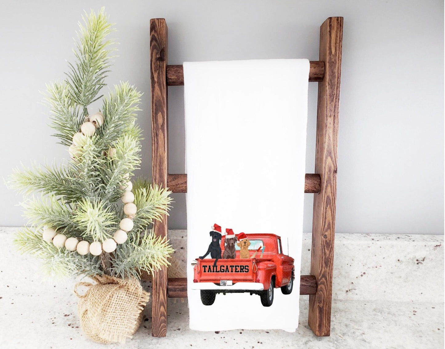 Tailgaters - Red Truck with 3 Labs Holiday Tea Towel